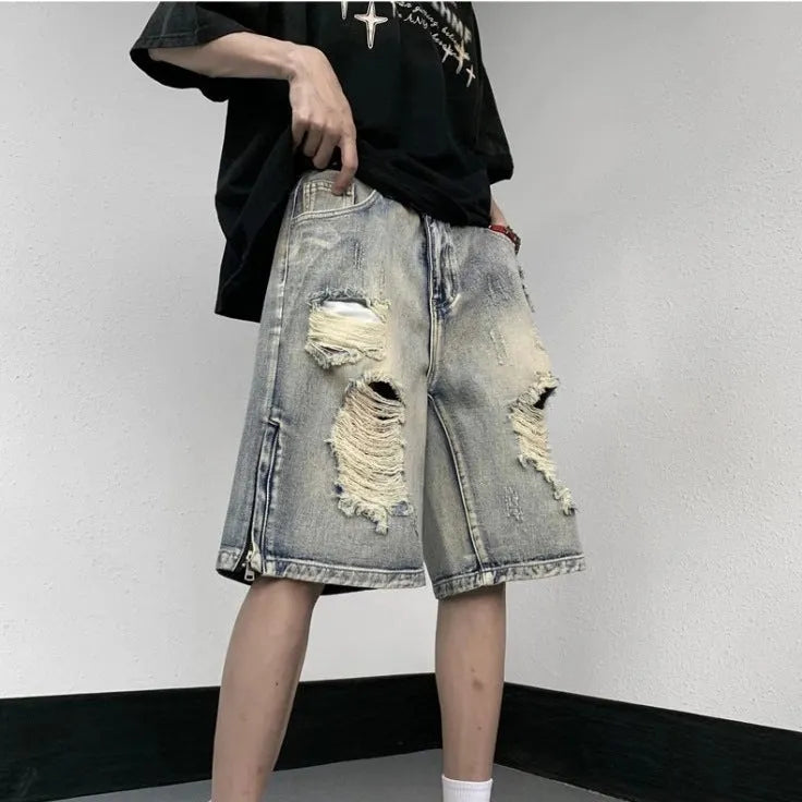 Blue wide-leg denim shorts with tattered retro styling and loose fit design