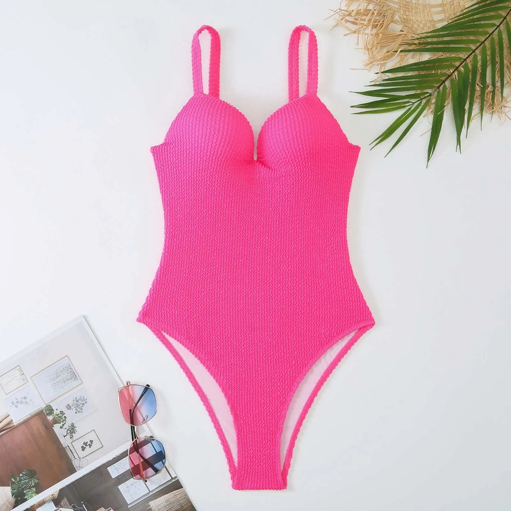 Women's black and striped one-piece sleeveless swimsuit laid flat.