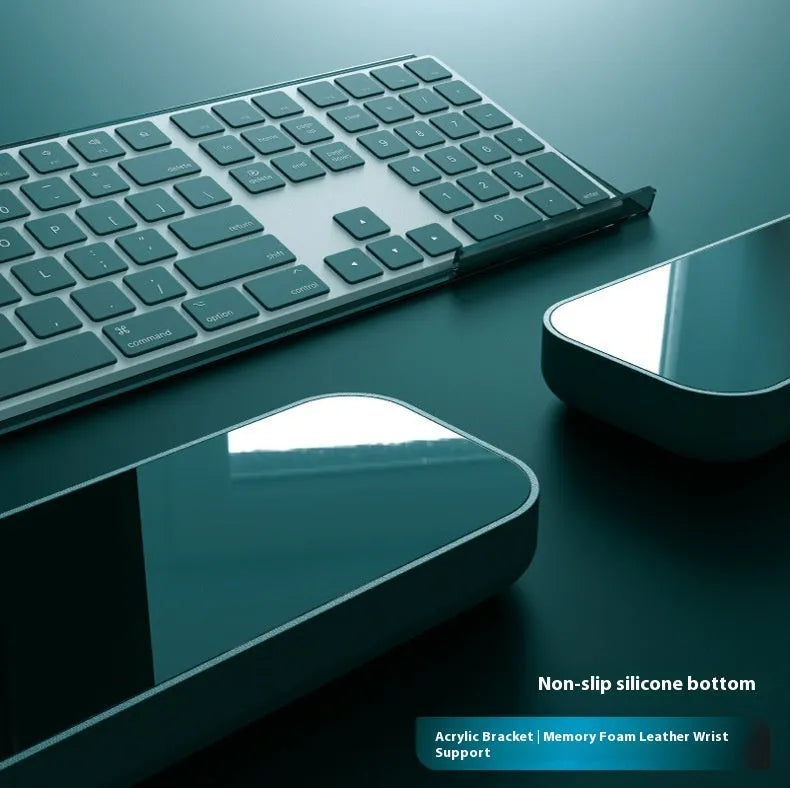 Double-sided ergonomic mouse pad with memory foam wrist rest on a resin base, shown in a solid colour.