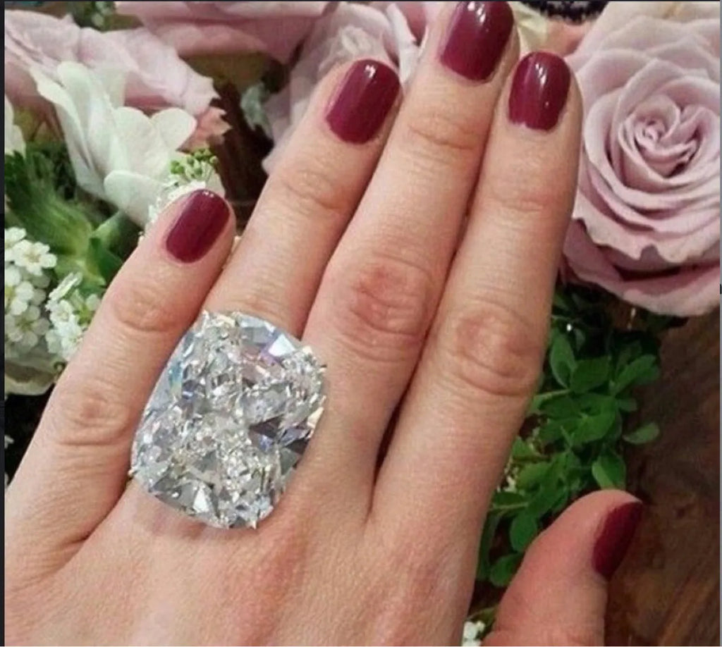 Simple geometric women's alloy ring with an inlaid white square diamond and a white gold colour finish.