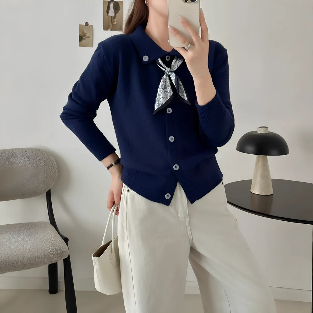 Beige lapel scarf collar acrylic cardigan with long sleeves on a hanger