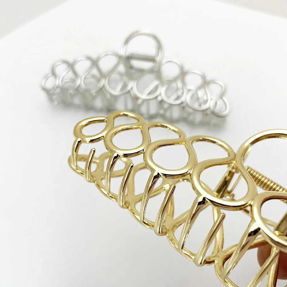 Large gold or silver electroplated alloy hair clip with tassel detail for thick hair updos