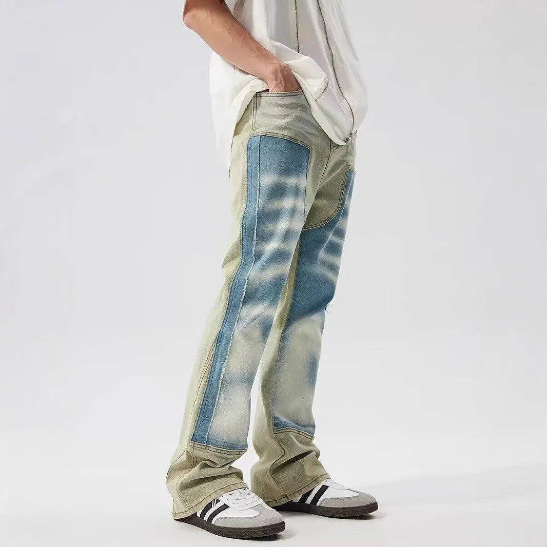 Men's yellow and blue patchwork distressed jeans with splash-ink design detail