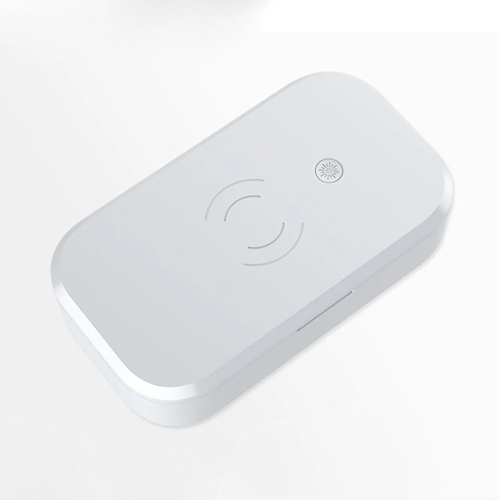 Compact white ultraviolet disinfection box with wireless charging surface for mobile phones