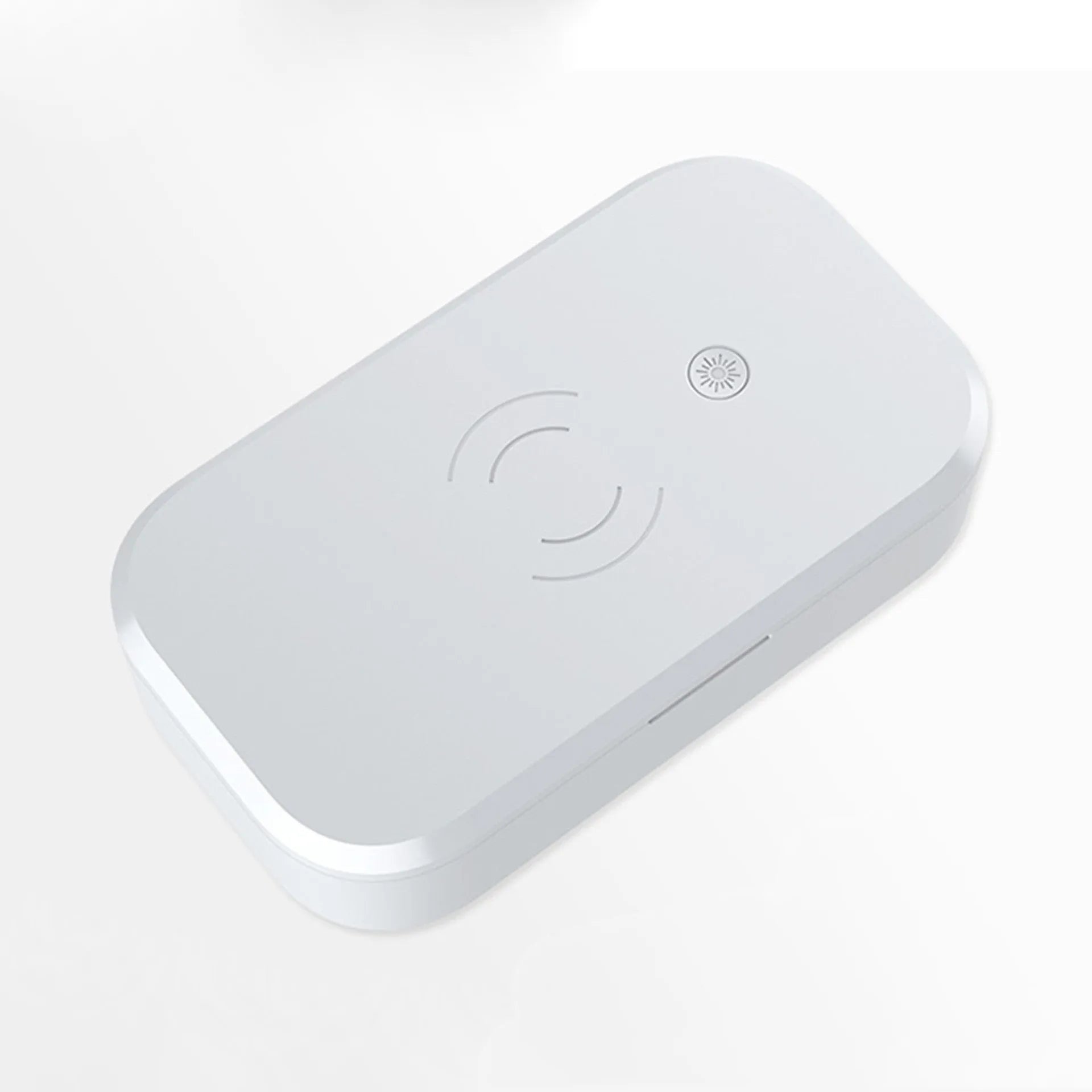 Compact white ultraviolet disinfection box with wireless charging surface for mobile phones