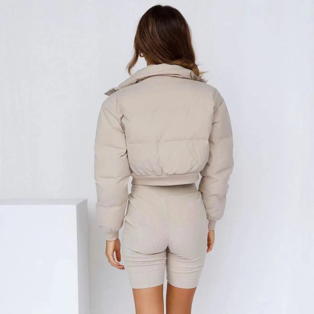 Women's loose blue polyester jacket with long sleeves shown front view