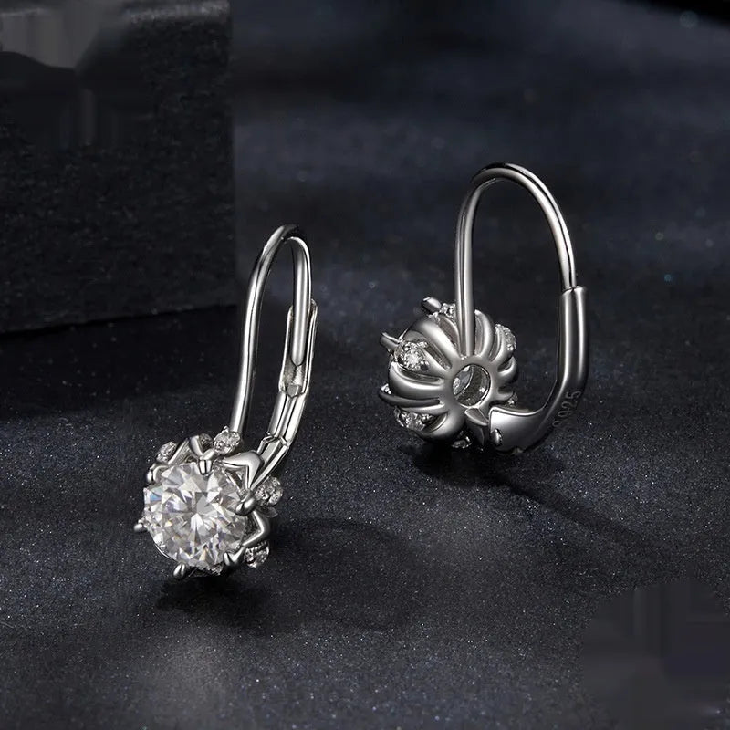 Sterling silver flower bud ear clip earrings with white gold plating and moissanite stone