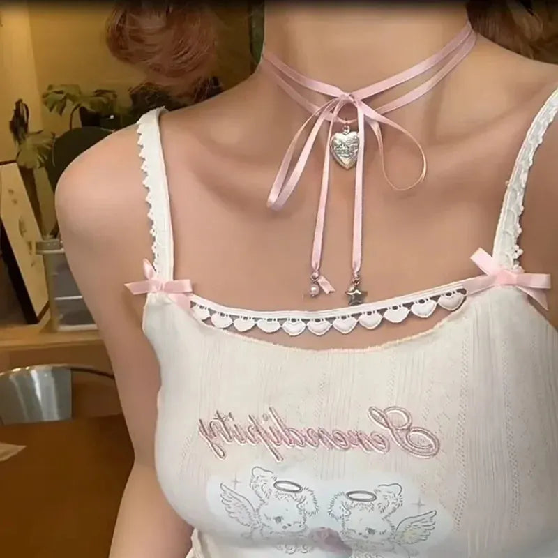 Women's alloy love pendant necklace with ribbon detail on a clavicle chain, electroplated finish.