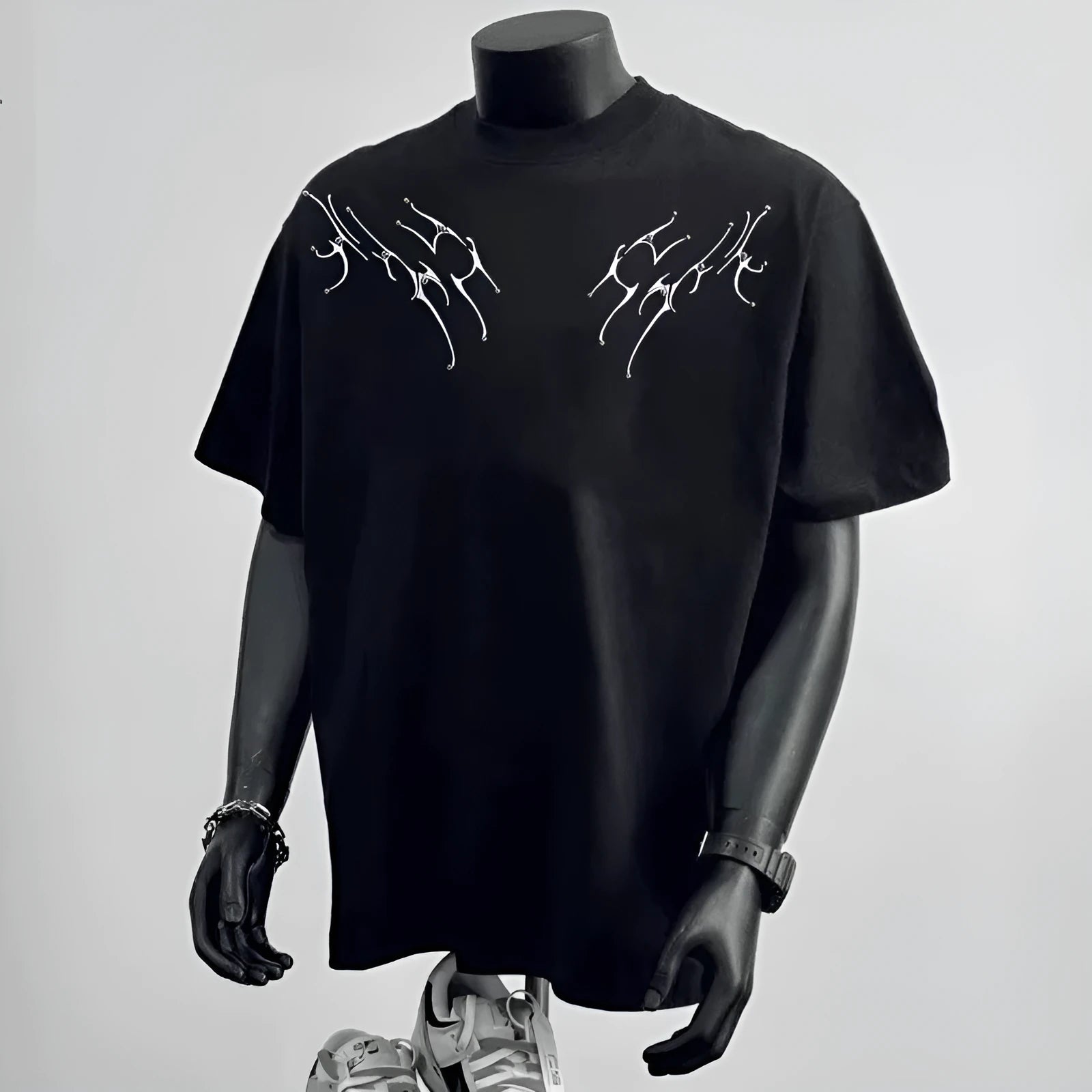 Men's loose fit black cotton t-shirt with a white printed letter design on the chest