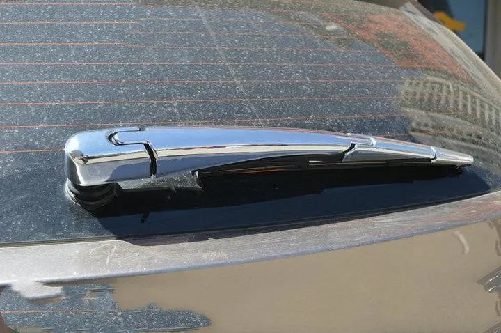 Set of four silvery ABS plastic rear window wiper cover trims for Hyundai 2010 model year vehicles.