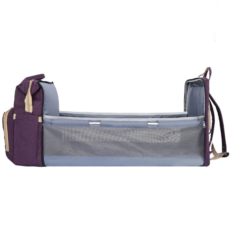 Portable folding crib mummy bag in nylon with curved shoulder strap and USB interface