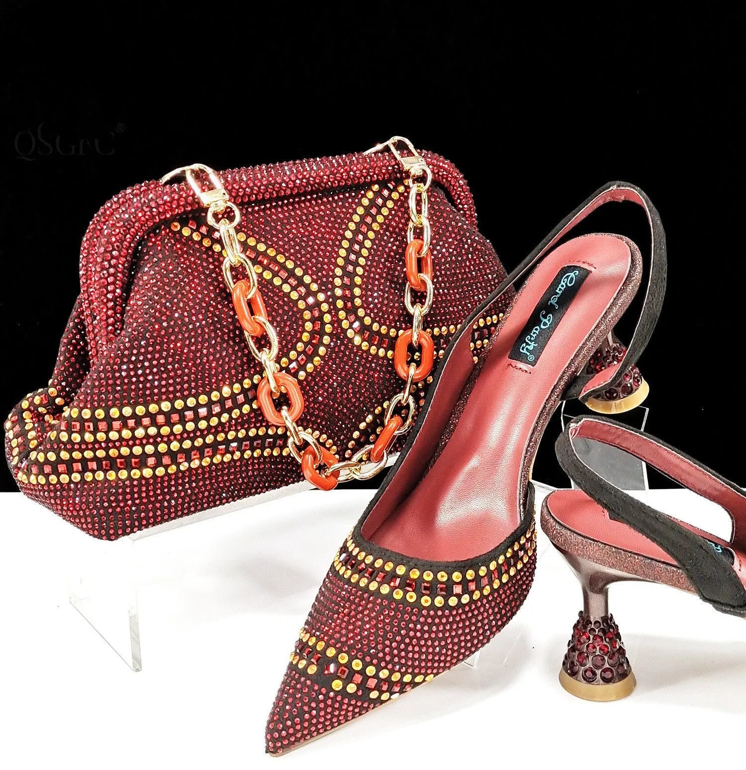 Women's pointed toe high heels with matching small bag, shown in a selected colour with a wine glass heel and rhinestone detail.