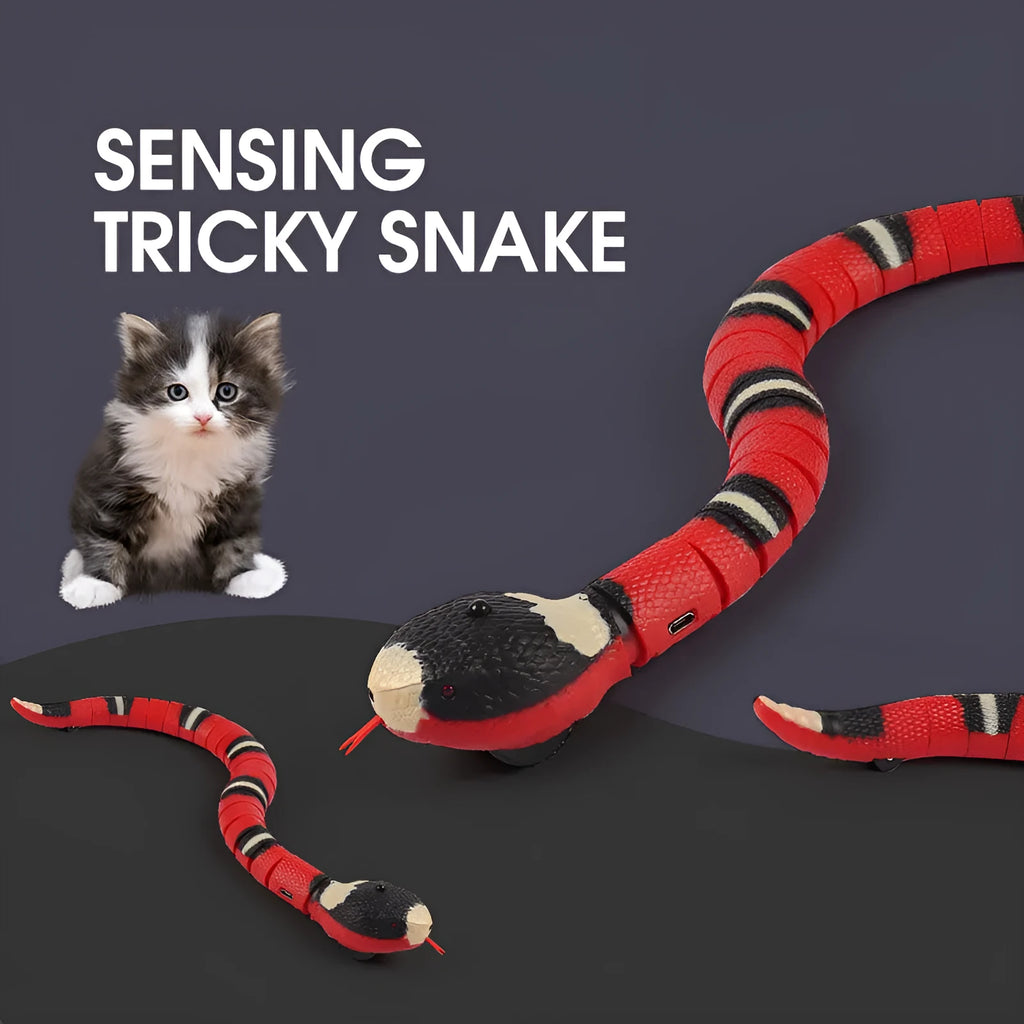 Automatic electronic snake cat toy with segmented plastic body on a floor