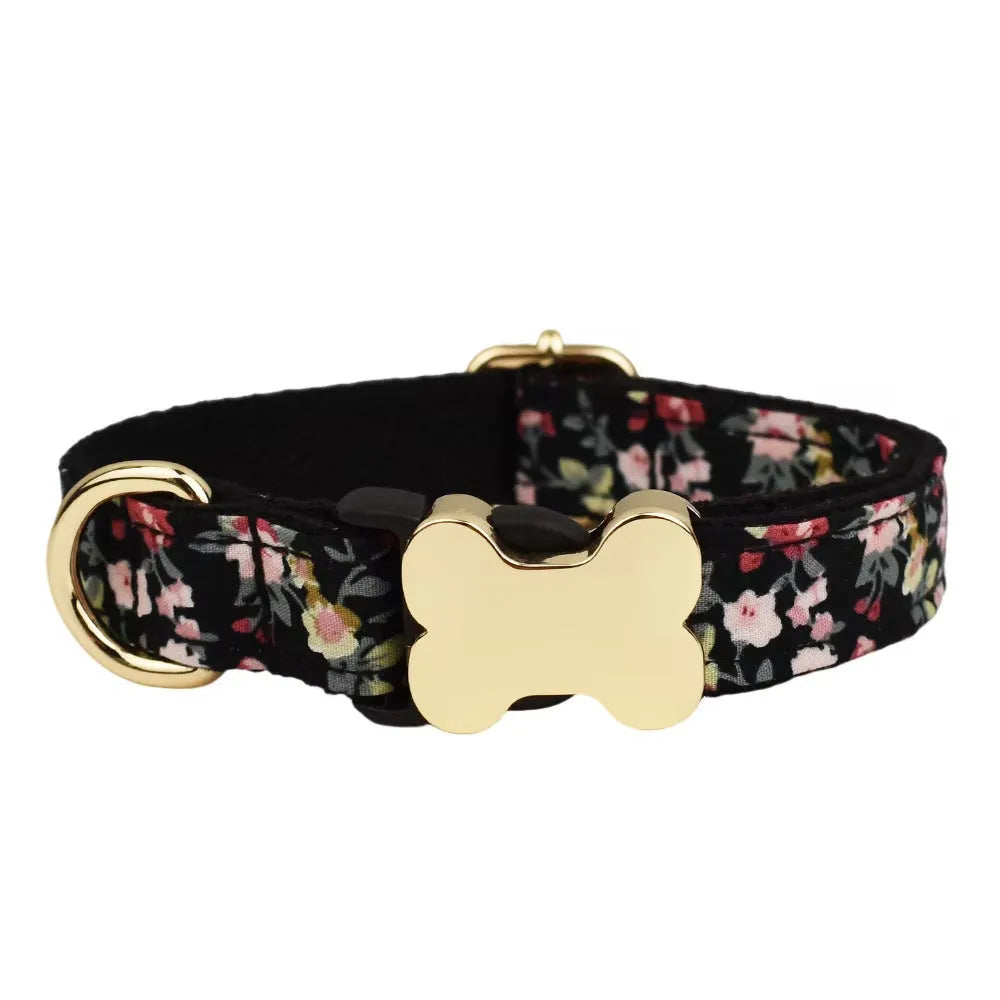 Flat nylon dog collar with grey grid print and a white bone-shaped plastic buckle.