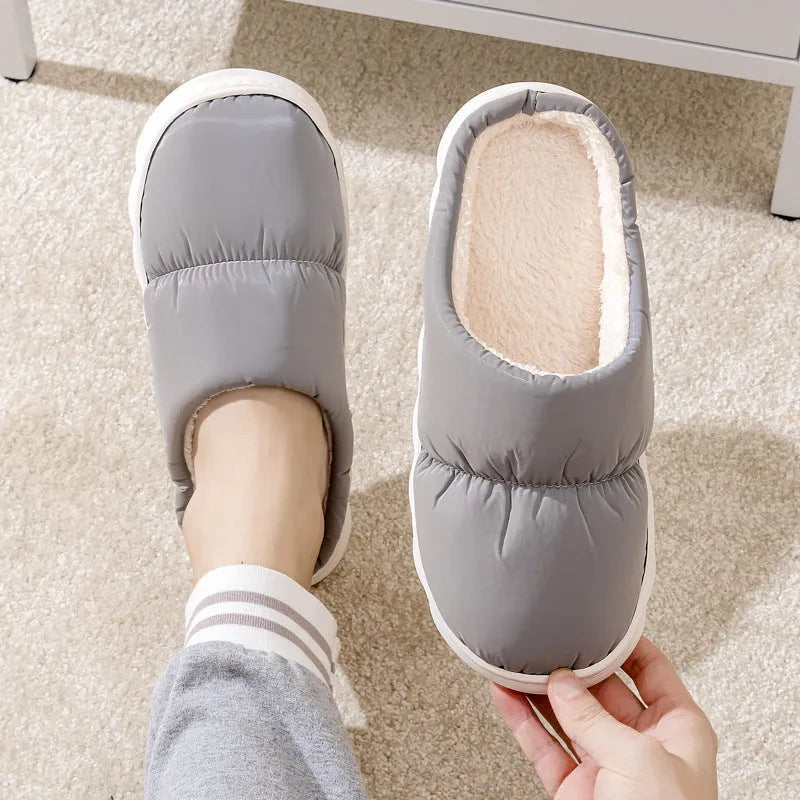 Blue winter slippers with artificial leather upper and thick rubber sole, showing plush lining.