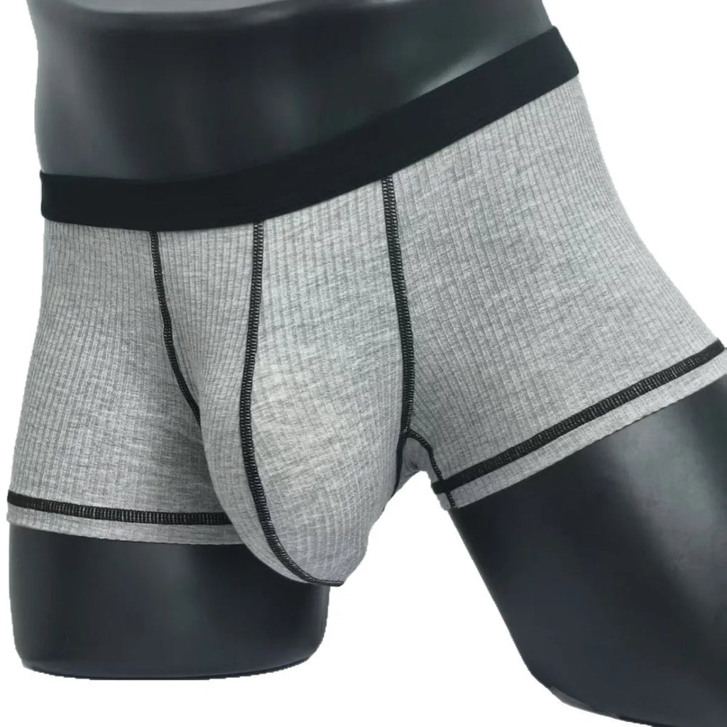 Solid colour men's boxer shorts in breathable fibre fabric, shown in Army Green.