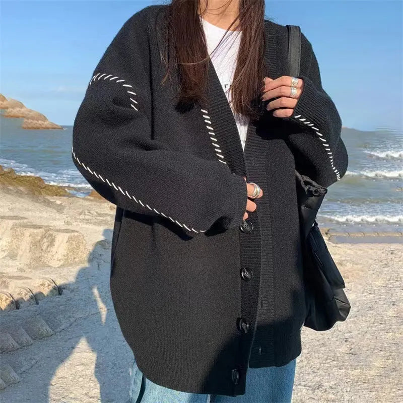 Women's loose fit knitted cardigan coat in black solid colour with long sleeves