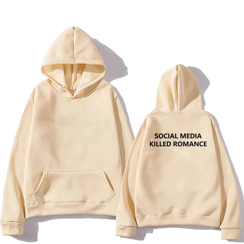 Man wearing a slim fit grey hoodie with a printed white spring letter pattern on the front.