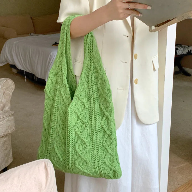 Knitted wool yarn shoulder tote bag with hollow crochet design in solid colour
