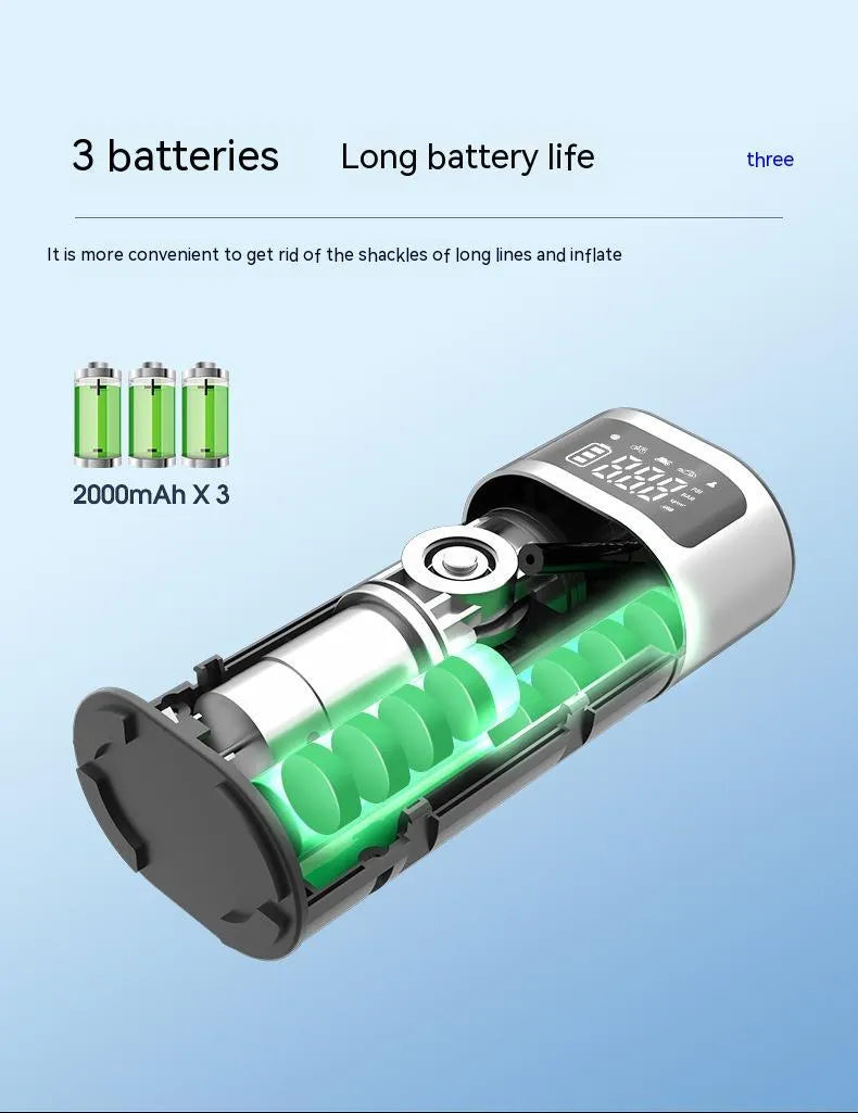 Black portable wireless smart air pump with display, charging cable and nozzle attachments on a dark surface.