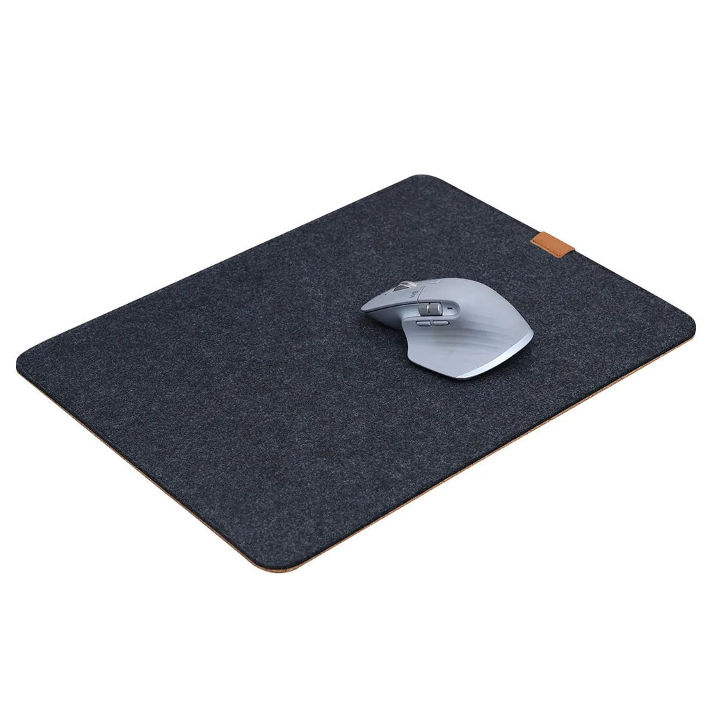 Oversized grey felt cork desk mat with non-slip backing shown on office desk