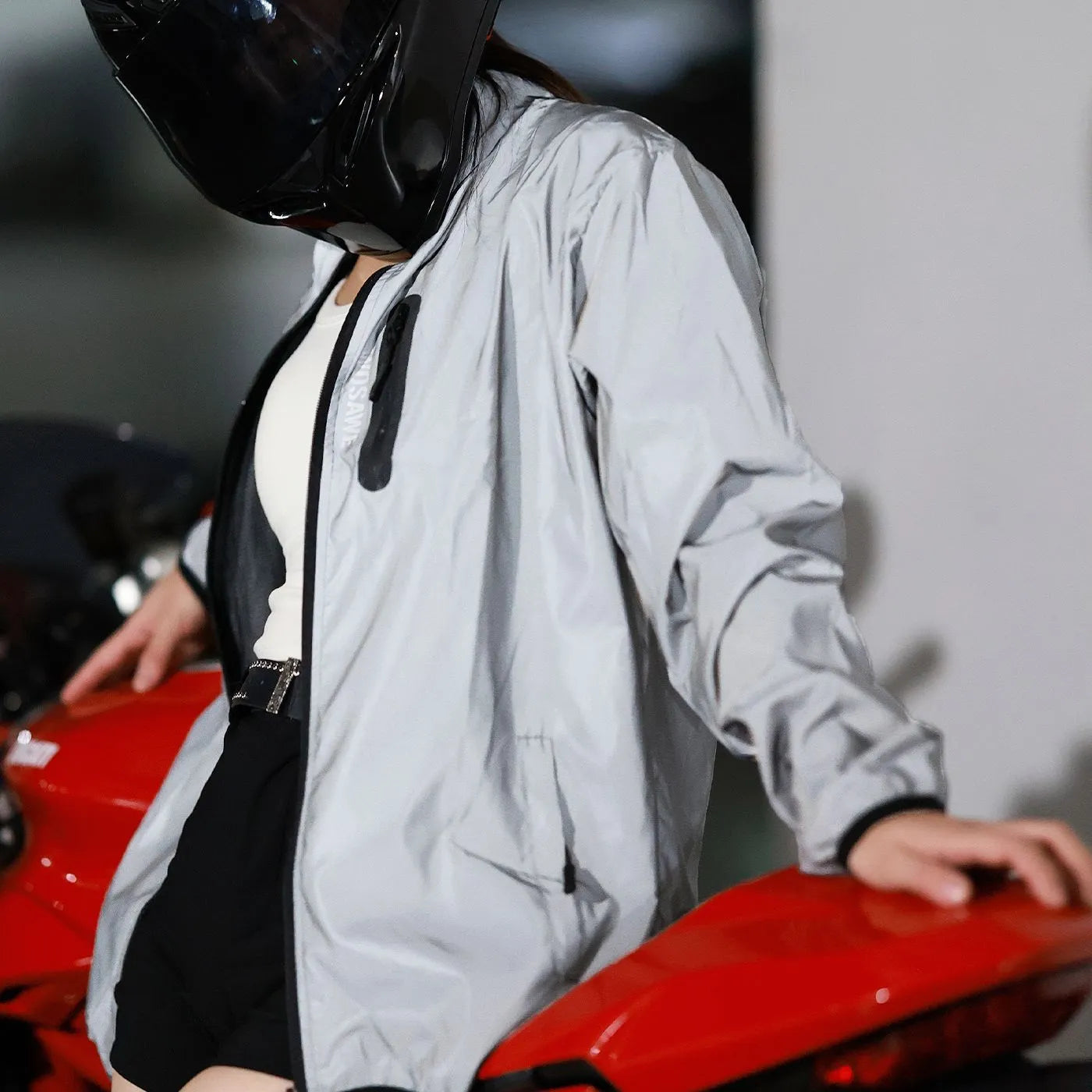 Silver waterproof polyester long sleeved jacket with windproof function, shown on hanger
