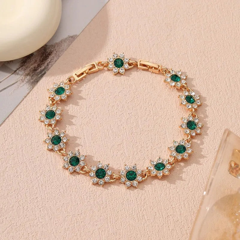 Gold and silver electroplated flower bracelet with coloured gemstone accents on zinc alloy