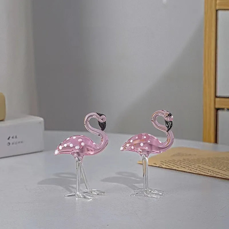 Pink crystal flamingo decorative sculpture on table with modern minimalist design