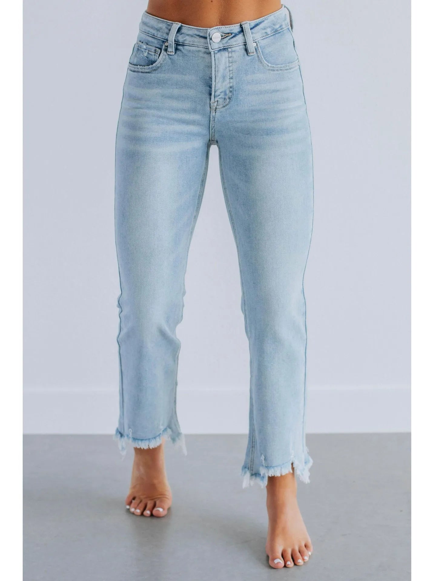 Solid colour women's denim jeans in dark blue and light blue washes, showing hand-worn detail.