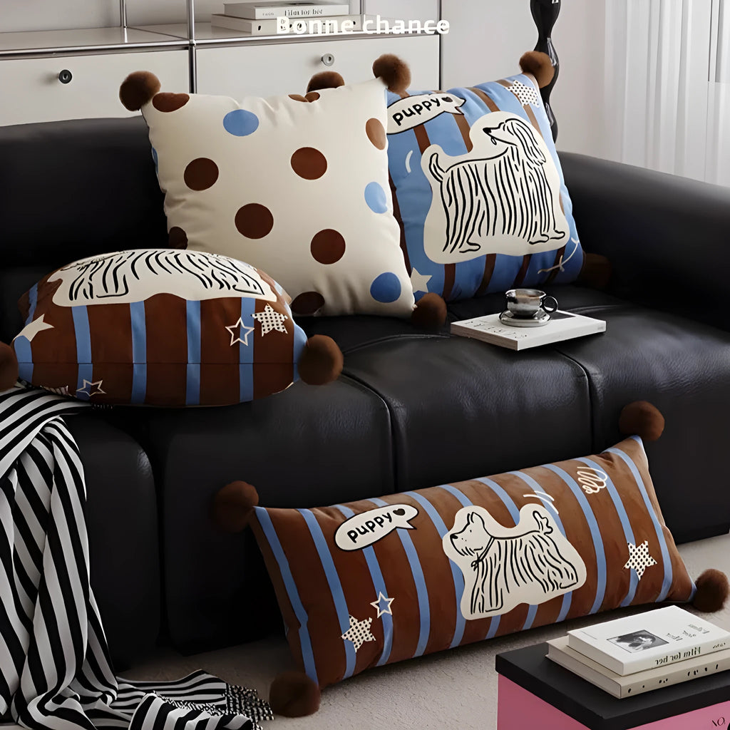 Blue cartoon animal print square sofa cushion with removable pillowcase on a grey sofa.