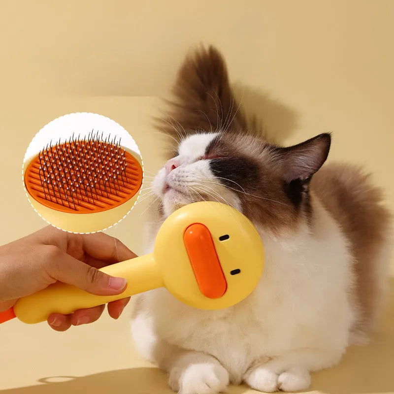 Small yellow duck-shaped pet grooming comb with open section design for cat and dog hair removal