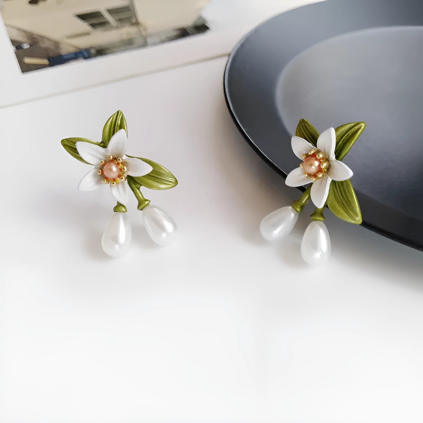 Women's flower ear clip earrings with sterling silver needle flowers and contrast colour alloy metal design