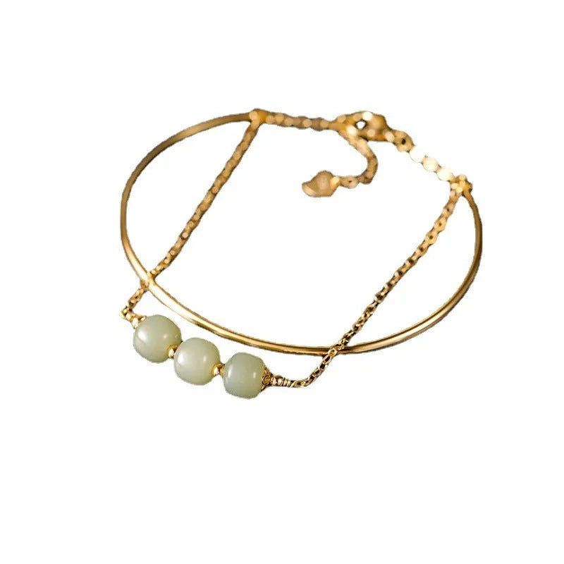 Women's Hetian jade lucky beads bracelet with gold inlay in single, double, and three-bead versions.
