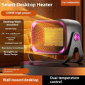 Compact white desktop ceramic heater with control buttons, shown on a wooden desk.