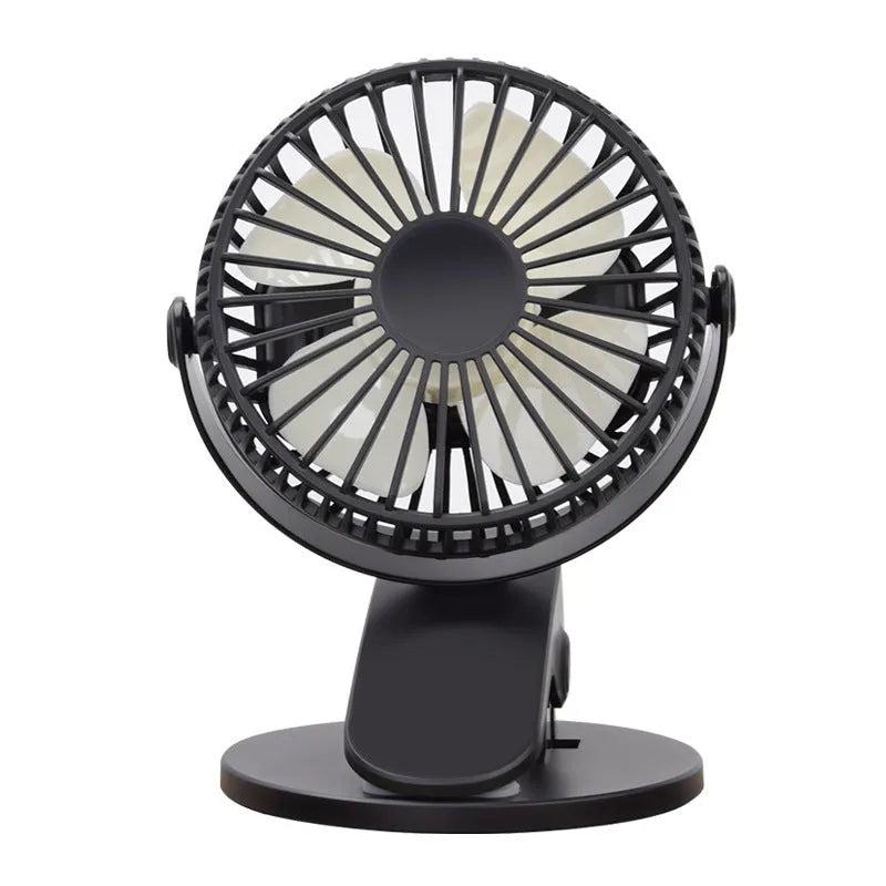 White USB clip fan with plastic blades mounted on desk edge showing piano button switch