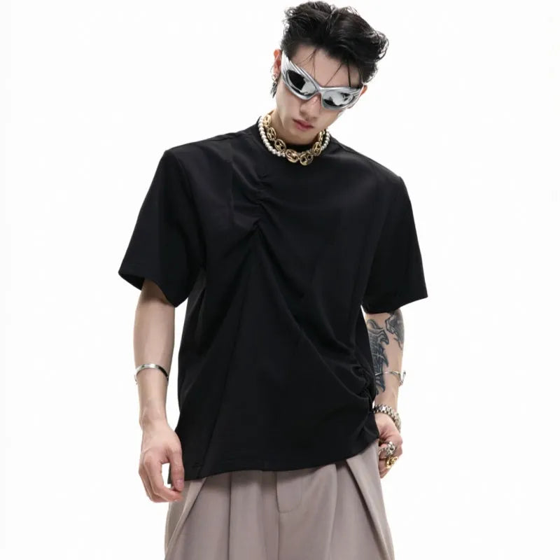 Men's loose fit cotton T-shirt with pleated detail and asymmetric stitching on a round neck, in solid black colour.