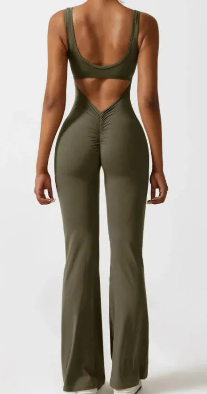 Women's black milk silk yoga bodysuit with seamless hollow design and mid-waist fit.
