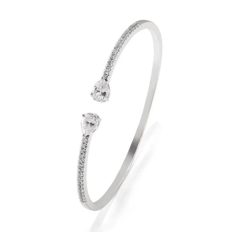 Copper bracelet with zircon inlay in white or blue colour simple design