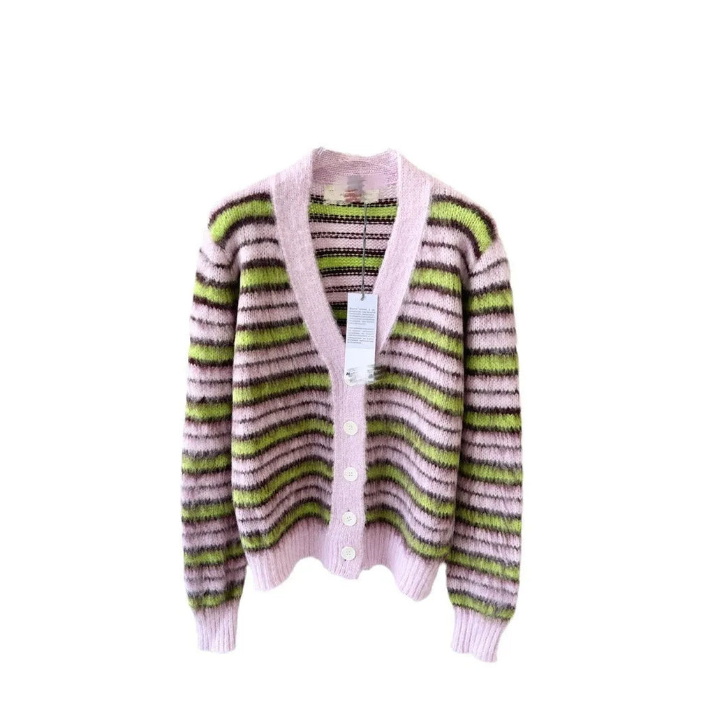 Pink women's wool knitted cardigan and round-neck pullover sweater with contrast details on a hanger.