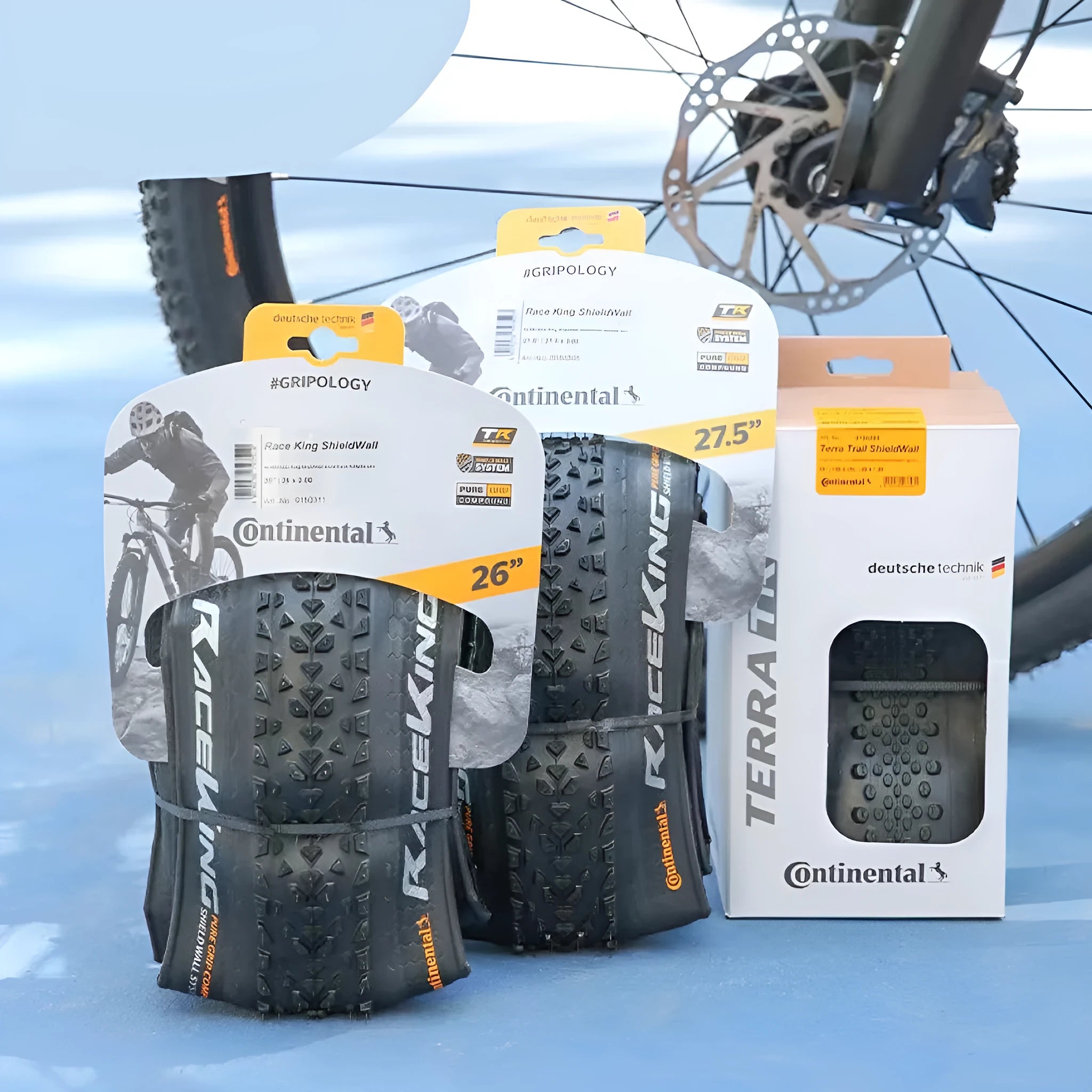 Mountain bike outer tyre showing yellow and white sidewall options for 26, 27.5, and 29-inch wheel sizes.