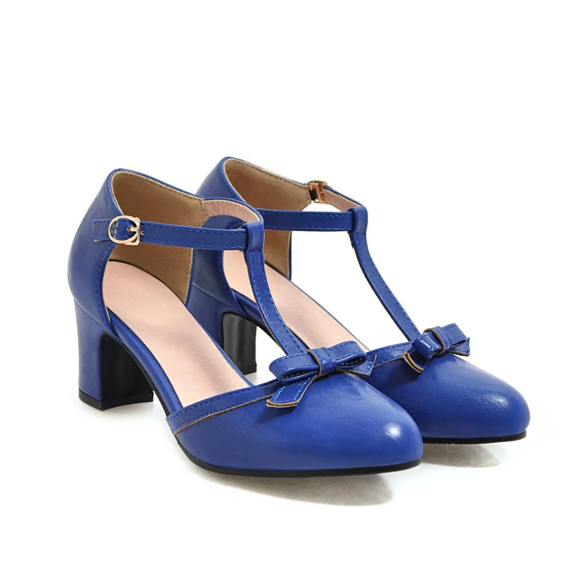 Women's apricot coloured chunky heel sandals with a bow tie and adjustable buckle strap.