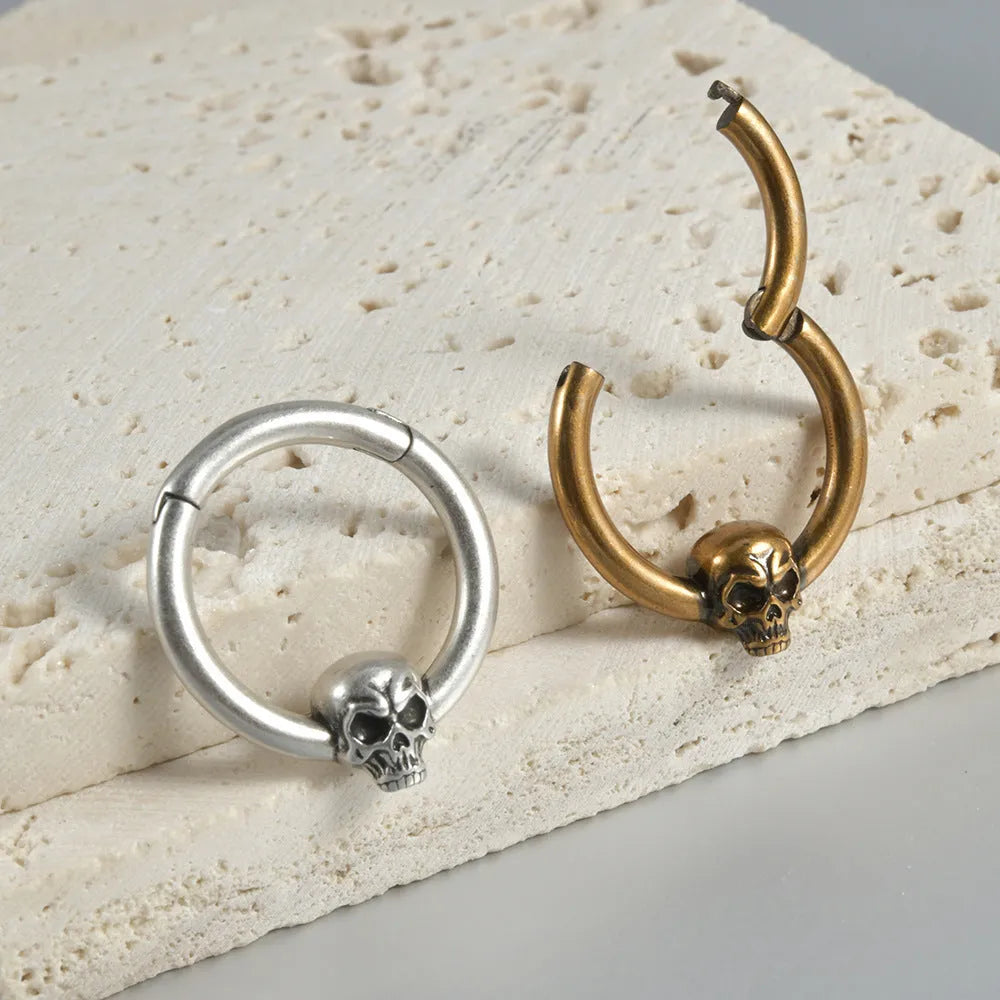Copper punk earrings with ghost head designs in antique silver or ancient gold finishes