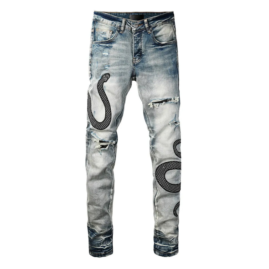 Blue distressed skinny jeans with a mid-waist and button-fly opening on a neutral background.