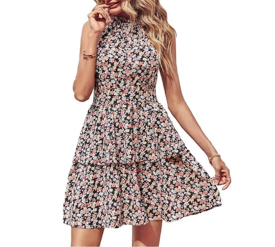 Women's summer halter dress with backless boho design and A-line ruffle detailing in printed polyester