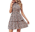 Women's summer halter dress with backless boho design and A-line ruffle detailing in printed polyester