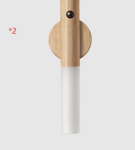 Smart sensor LED desk lamp with solid wood base and clear acrylic shade on a wooden table.