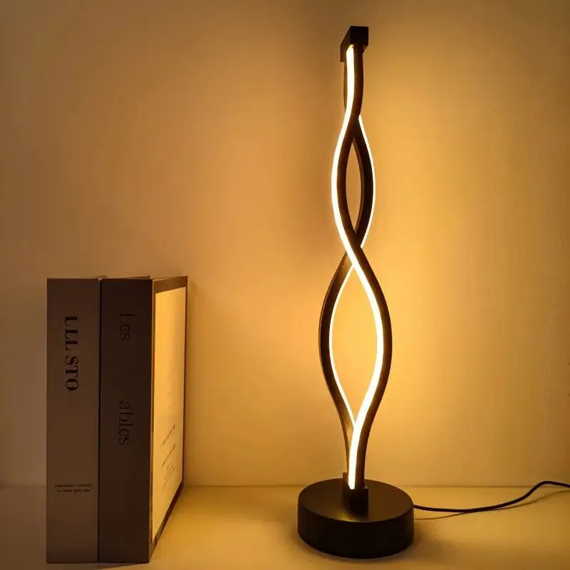 Black aluminium desk lamp with touch dimming controls and three-colour adjustment button