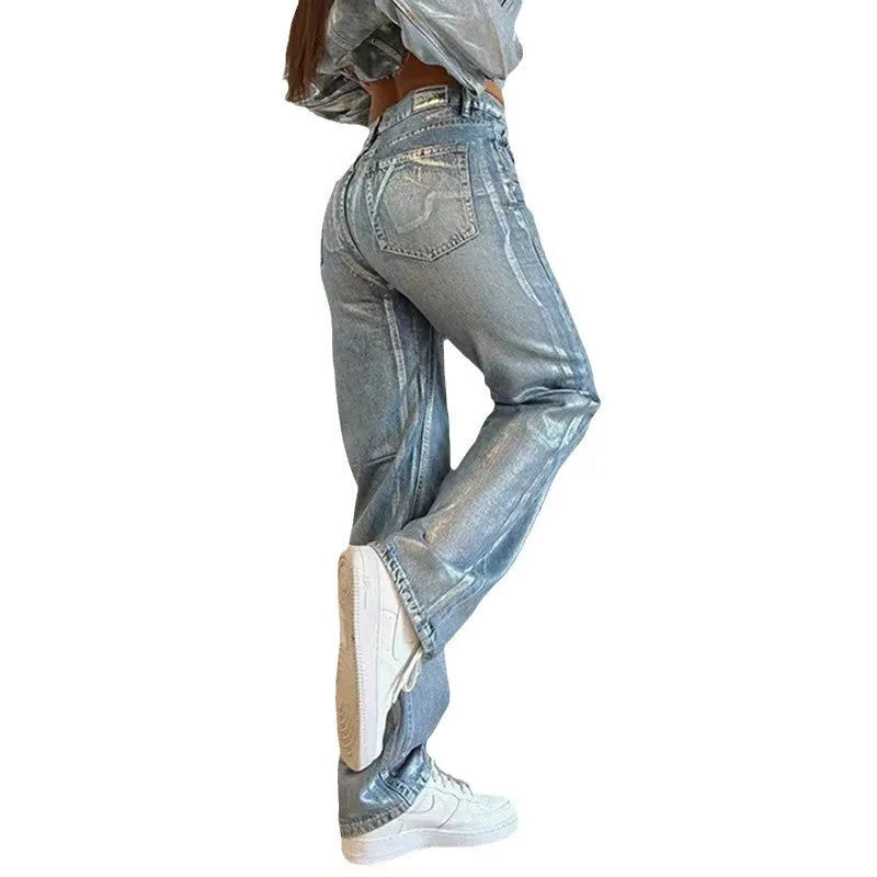 Blue high waist straight leg women's jeans with silver contrast stitching on denim fabric