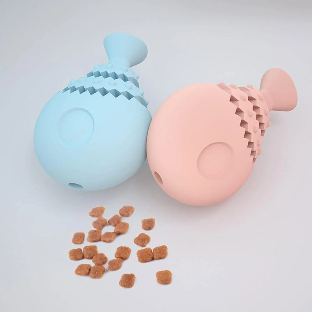 Blue green and pink fish bone shaped silicone dog chew toy with a visible hole in the base