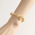 Gold electroplated rutilated quartz bracelet showing Korean style design and lucky fortune gold colour